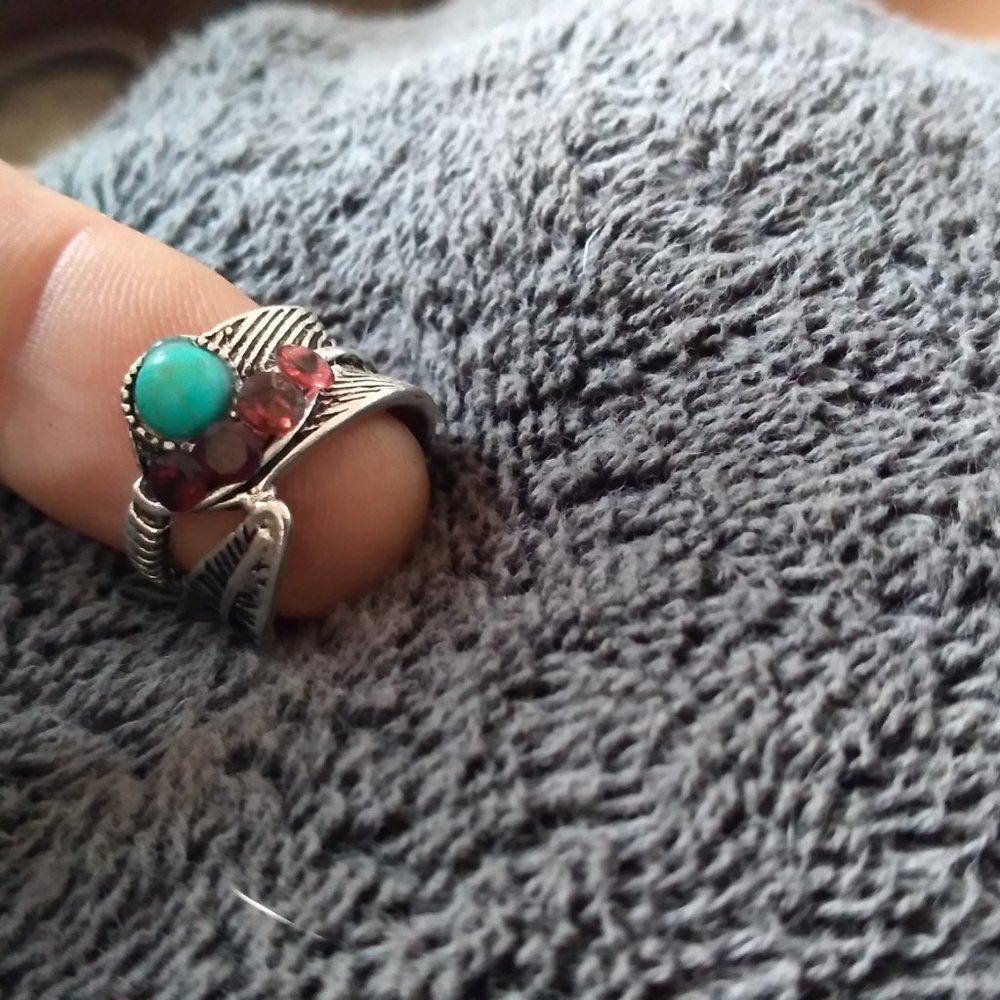 Simulated Turquiose wrapped in mixed metal silver tone ring with red garnets